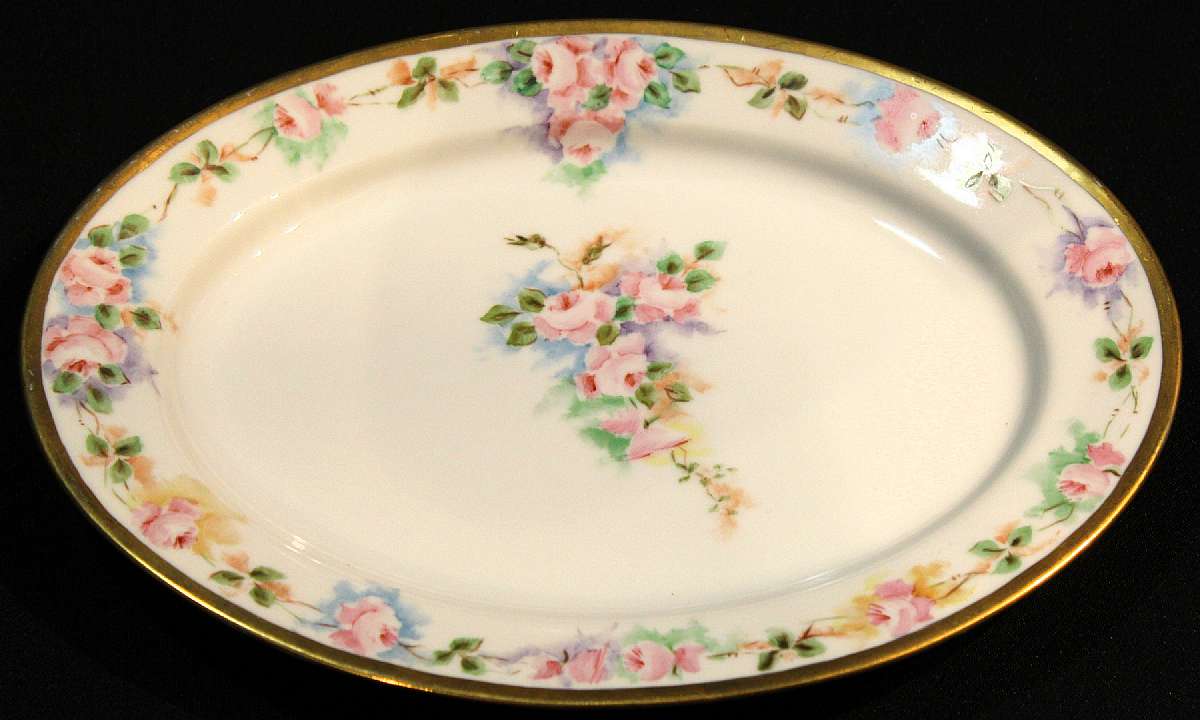 Up for sale is this Royal Bayreuth Antique Pink Rose Floral Platter in great condition with no chips, cracks or crazing. Minor Gold Wear. The platter measures approx. 11 3/4"L by 8 1/2"W. This mark was used around 1902. Please see my other sales