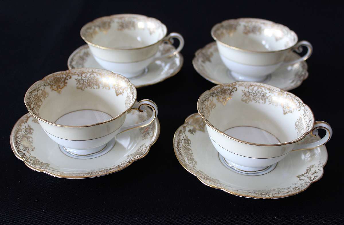 Up for sale is this Noritake Gastonia Set Of Four Cups & Saucers in great condition with no chips or cracks and minor gold wear. The saucers measure approx. 5 1/2"W and the cups are about 4"W by 2"D.   Shipping Excludes: Alaska/Hawaii,