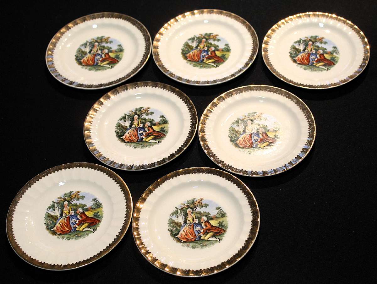 Up for sale are these Prim Rose China Loving Couple set of 7 Bread & Butter Plates With gold Trim in excellent condition with no chips or cracks or crazing. They measure approx. 6 1/4"W. Please see my other sales for more of this rare pattern.