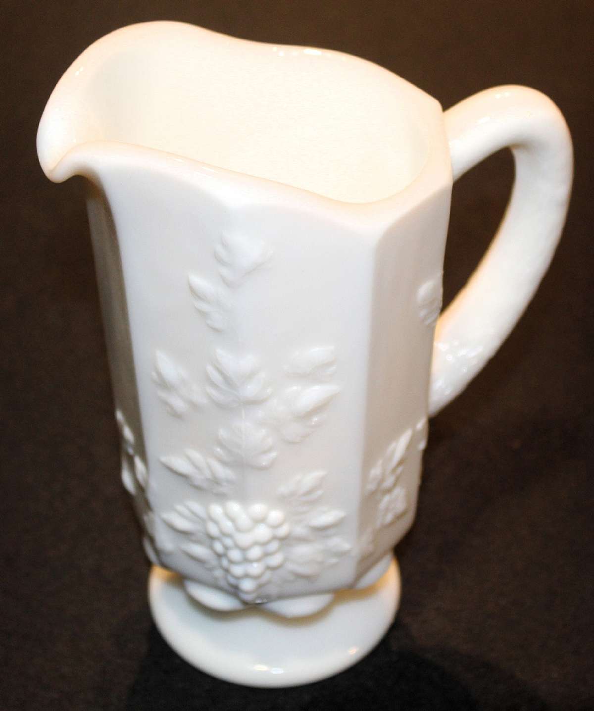 Up for sale is this Westmoreland Milkglass Grape Design Small Pitcher in excellent condition with no chips or cracks.  Marked with the WG on the reverse. Measures approx. 8"Tall. Shipping Excludes: Alaska/Hawaii, US Protectorates, APO/FPO, PO BoxSh