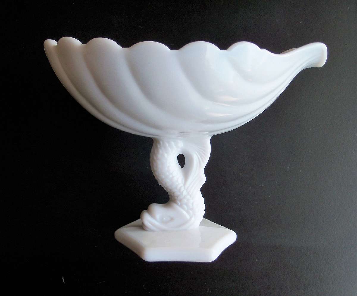 Up for sale is this Koi Fish Milk Glass Compote Bowl in great condition with no chips or cracks. It measures approx. 6 1/4"T by 6 1/4"W by 8 1/2"L.Shipping Excludes: Alaska/Hawaii, US Protectorates, APO/FPO, PO BoxShipping Provided to the