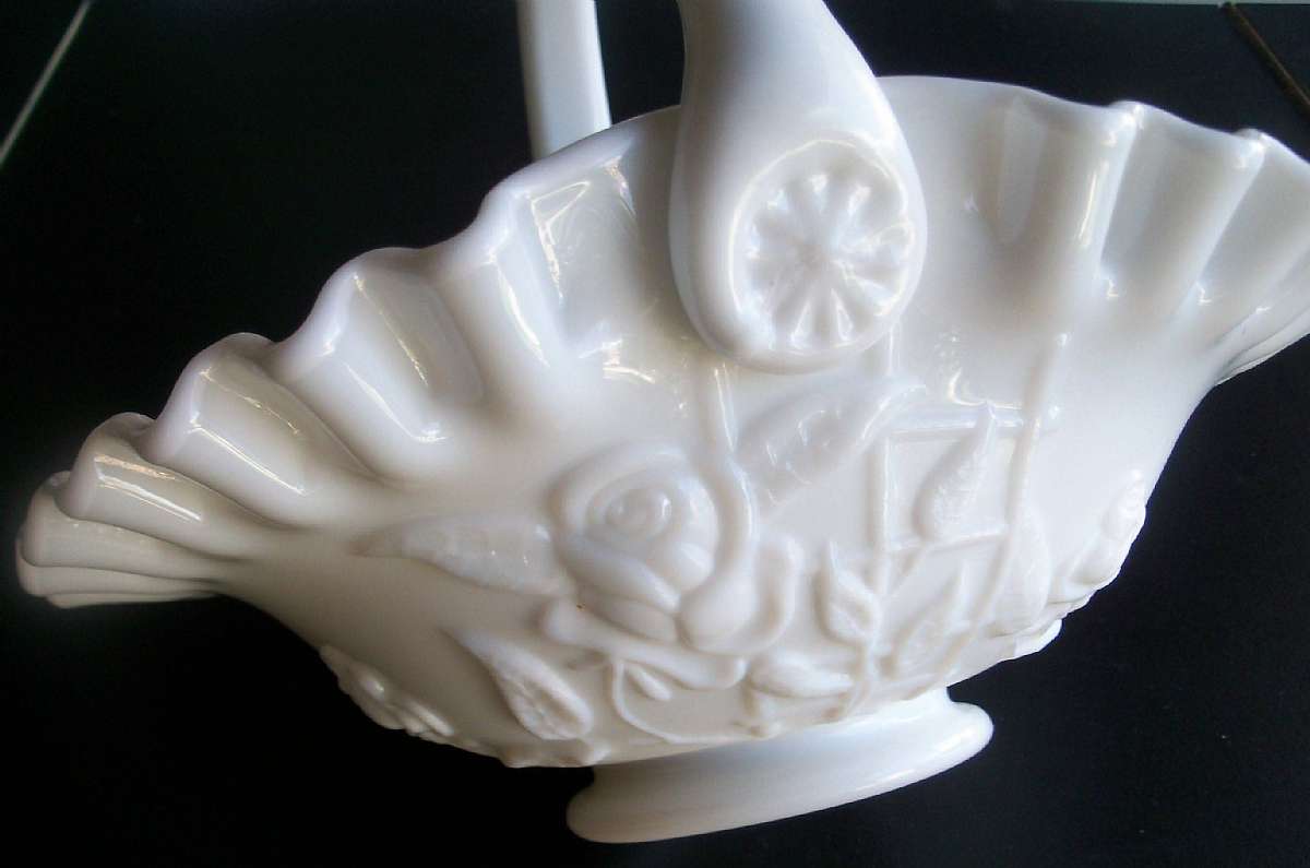 Up for sale is this Westmoreland Milk Glass Basket Rose & Trellis in great condition with no chips or cracks. The basket measures approx. 8 1/4 inches wide at its widest part & about 7 1/2 inches high with the handle. Beautiful Piece.Shipping Exc