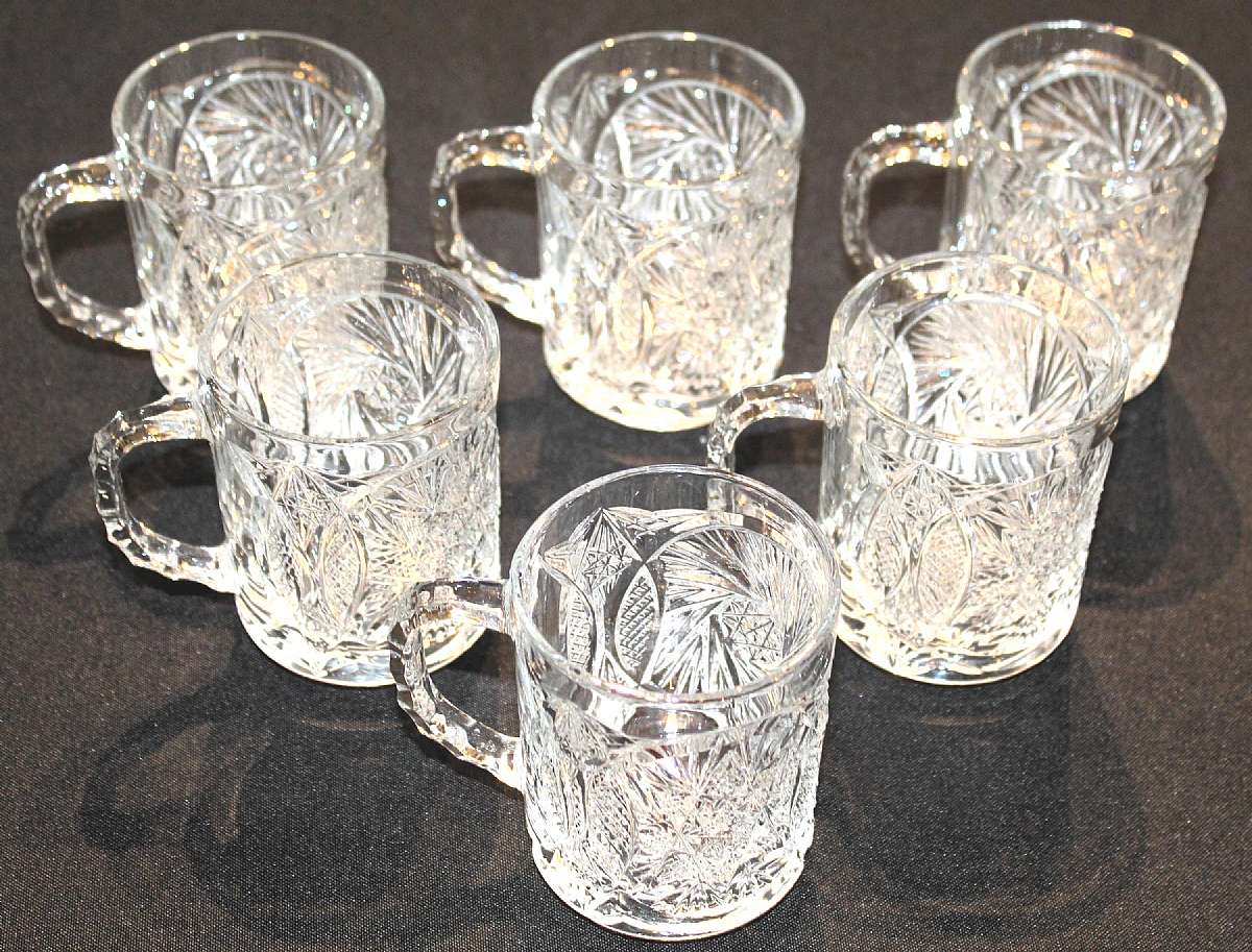 Up for sale are these Six Gorgeous Glass Cut Or Pressed Glass Mugs in excellent condition with no chips.  They measure approx. 3 3/4"T by 2 3/4"W and hold approx. seven ounces.Shipping Excludes: Alaska/Hawaii, US Protectorates, APO/FPO, PO Box
