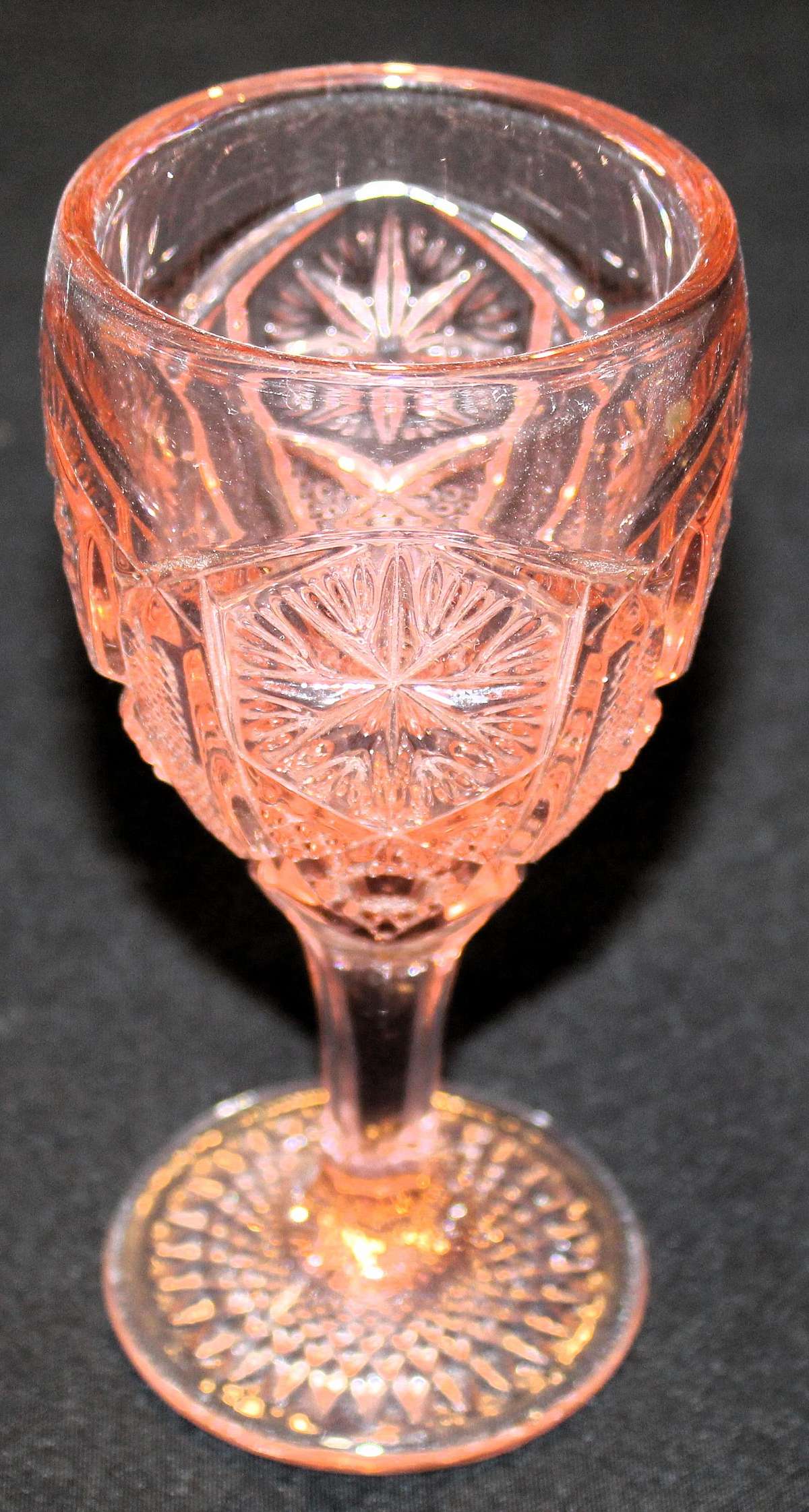 Up for sale is this Imperial Glass-Ohio Mogul Variant Water Goblet Pink in great condition with no chips or cracks. It measure approx. 6 3/4"T by 3"W. Shipping Excludes: Alaska/Hawaii, US Protectorates, APO/FPO, PO Box Shipping Provided to the