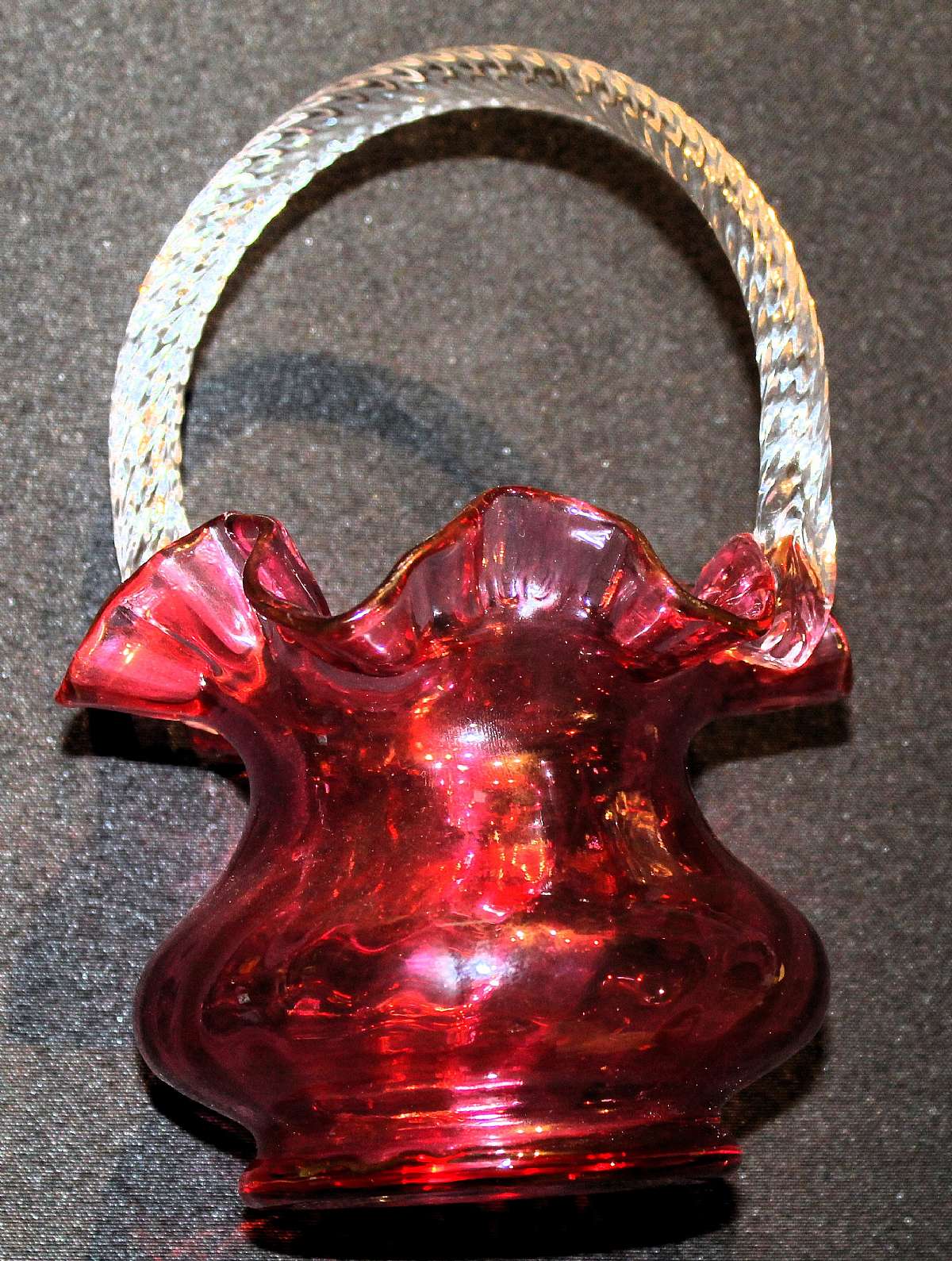 Up for sale is this Vintage Cranberry/Ruby Glass Basket in excellent condition with no chips or cracks. It measures approx. 8"T by 5"W.  Shipping Excludes: Alaska/Hawaii, US Protectorates, APO/FPO, PO BoxShipping Provided to the United States