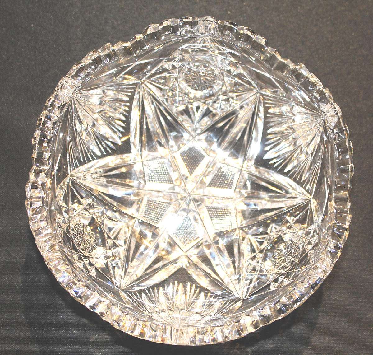 Up for sale is this Beautiful Antique Cut Glass Saw Tooth Rim Heavily Decorated Bowl. Measures approx. 7"W by 3"Deep. This does have a chip on the rim pictured a couple on the reverse in the design. Beautiful piece. Shipping Excludes: Alaska/Ha