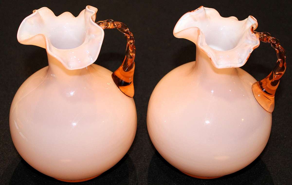 Up for sale are these vintage Pink Peach Cased Glass Set of Two Matching Pitchers in excellent condition with no chips or cracks. They measure approx. 7"Tall. Shipping Excludes: Alaska/Hawaii, US Protectorates, APO/FPO, PO BoxShipping Provided to t