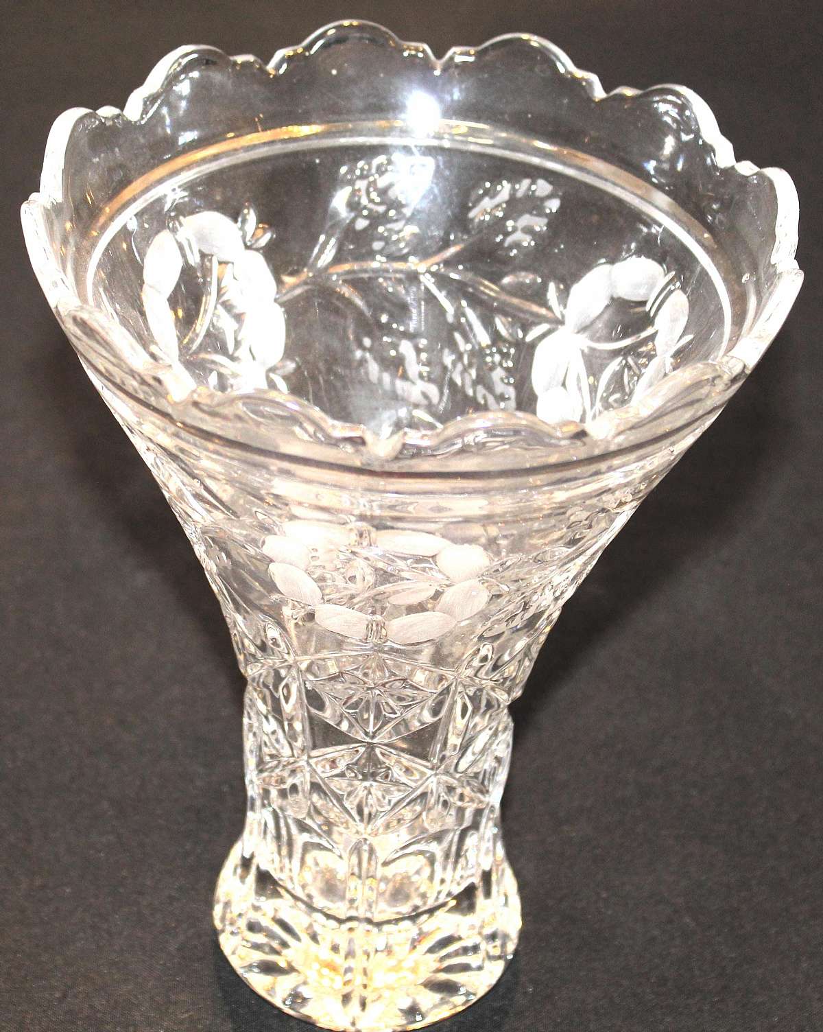Up for sale is this Large Tall Beautiful Glass Floral Etched Flower Vase in great condition with no chips or cracks. It measures approx. 10 1/4 inches tall and 7 1/4 inches wide at top and 3 1/2 inches wide at the bottom. Must have been hand made as I see
