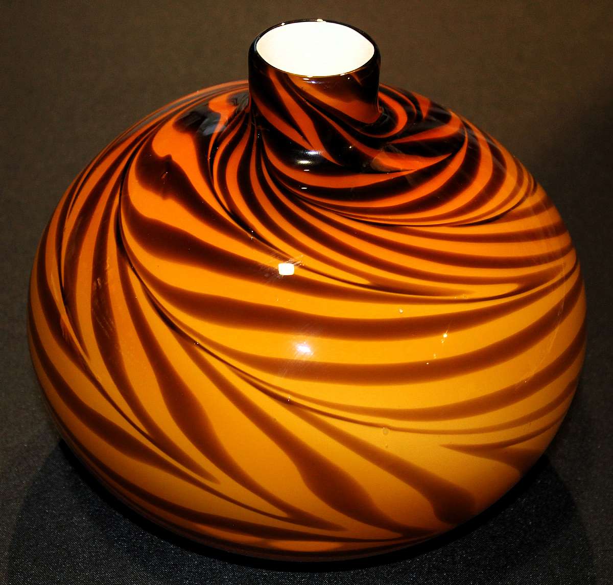 Up for sale is this Round Colorful Cased Glass Vase in excellent condition with no chips or cracks. Some air bubbles in the glass. The vase measures approx. 9"T by 10"W. Very nice decorative piece. Shipping Excludes: Alaska/Hawaii, US Protector