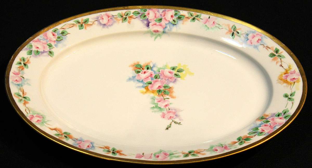 Up for sale is this Royal Bayreuth Antique Pink Rose Floral Platter in great condition with no chips, cracks or crazing. Minor Gold Wear. The platter measures approx. 14 1/2"L by 10 1/4"W. This mark was used around 1902. Please see my other sale
