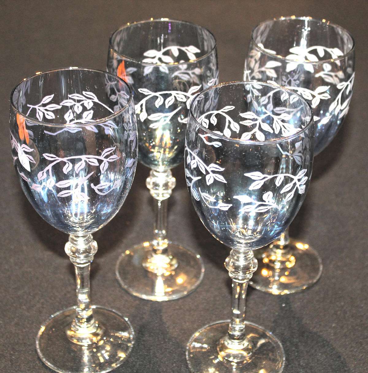Up for sale are these Beautiful Set Of Four Etched Fumo Blue Wine Glasses in excellent condition with no chips or cracks. The glasses measure approx. 8"T by 2 3/4"W. Shipping Excludes: Alaska/Hawaii, US Protectorates, APO/FPO, PO BoxShipping P