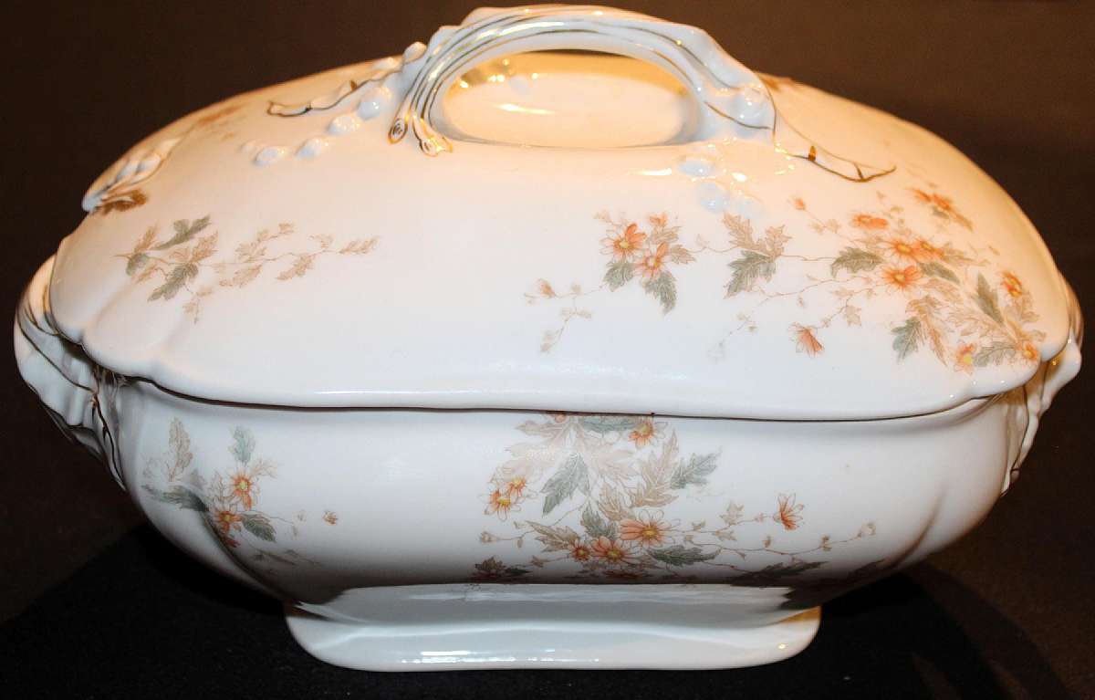 Up for sale is this T & V France Antique Lilly Pat 1884 Casserole Tureen in great gently used condition with no chips or cracks. It measures approx. 10 1/2"L by 7 1/4"W by 4 1/2" Deep. Nice piece that is well marked and is dated July 1st 84. Made for H.J.
