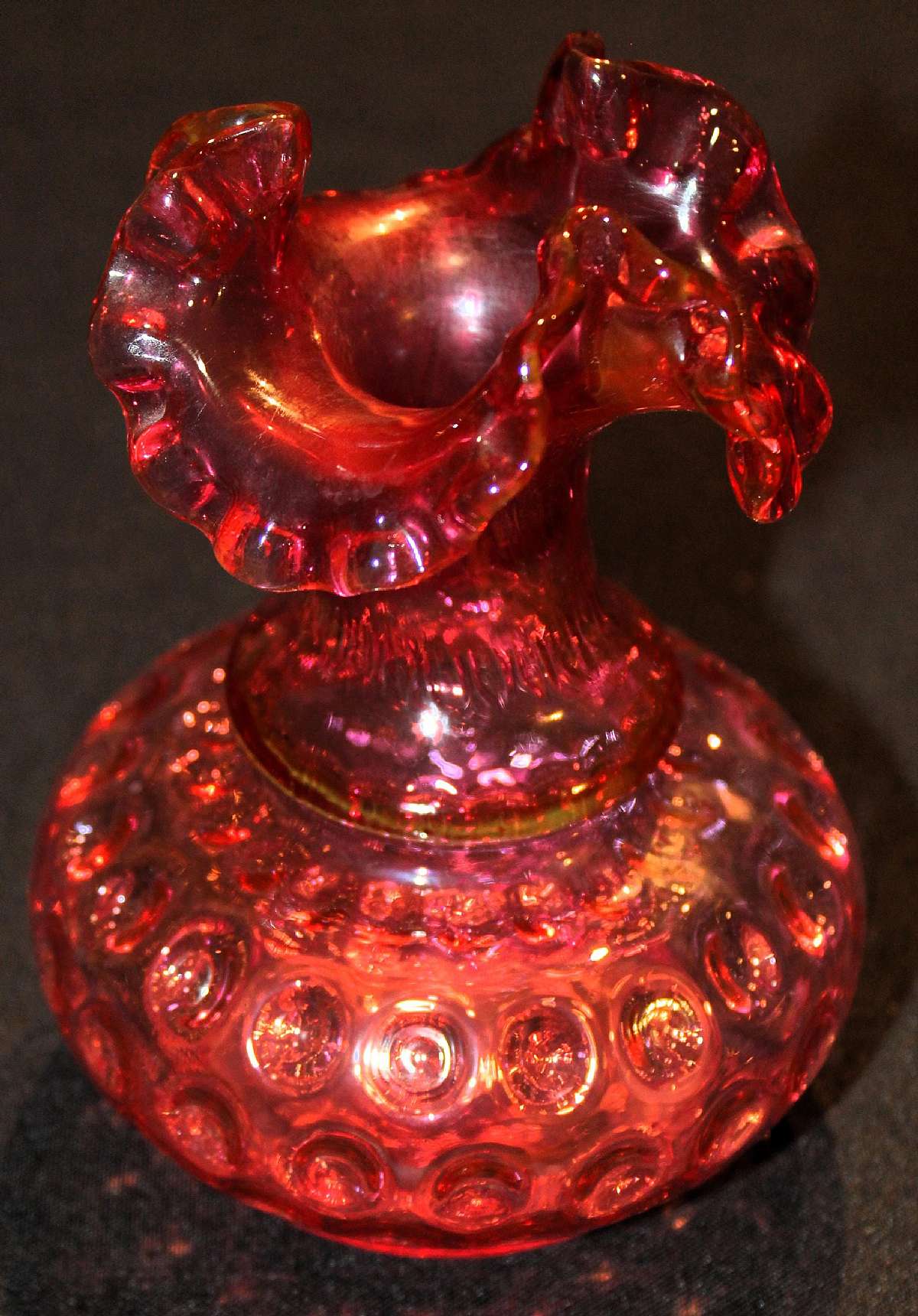 Up for sale is this Fenton Dot Optic Ruby Overlay Crimped Vase in excellent condition with no chips or cracks. It measures approx. 6"T. Shipping Excludes: Alaska/Hawaii, US Protectorates, APO/FPO, PO BoxShipping Provided to the United States Only.