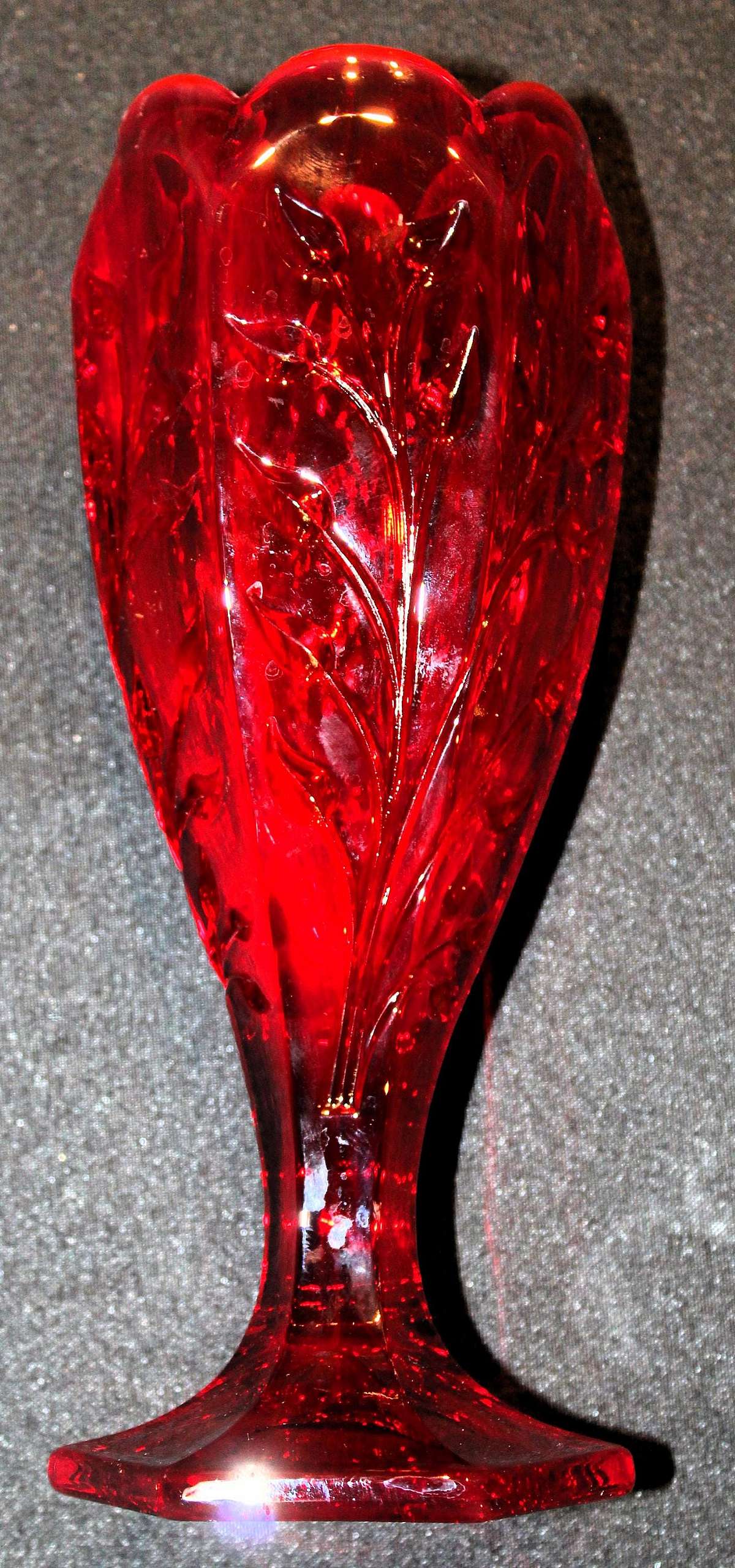Up for sale is this Fostoria Ruby Red Glass Rambler Vase Vine & Leaf Design in great excellent with no chips or cracks. It measures approx. 9 3/8 Inches tall by 3 1/2"W. Shipping Excludes: Alaska/Hawaii, US Protectorates, APO/FPO, PO BoxShippin