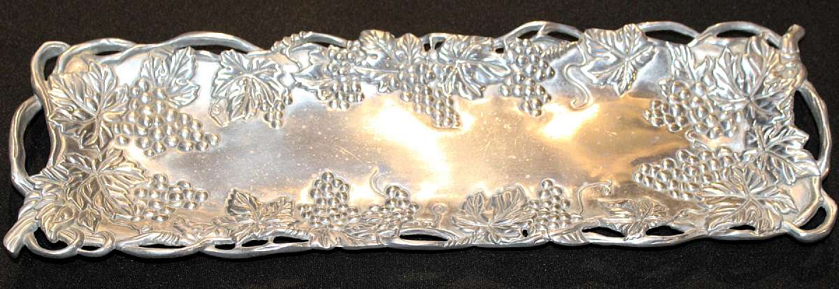 Up for sale is this Arthur Court Large Serving Platter. The platter measures approx. 19"L by 6"W. The Platter is dated 1995. Shipping Excludes: Alaska/Hawaii, US Protectorates, APO/FPO, PO BoxShipping Provided to the United States Only.