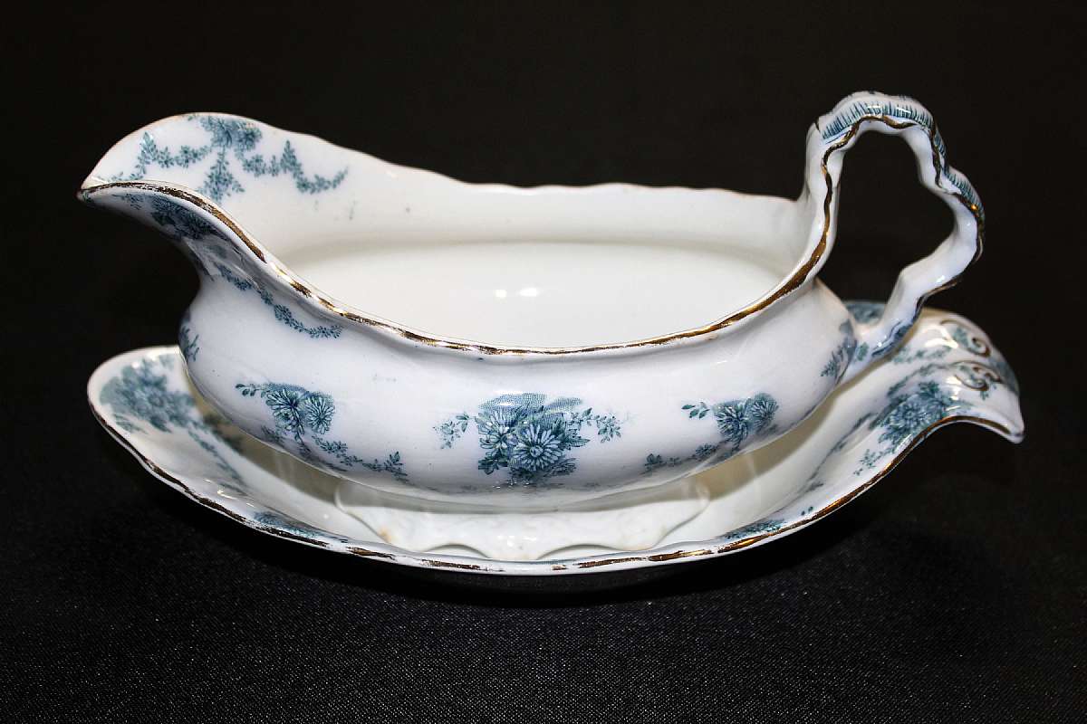 Up for sale is this Vintage Ridgways Lamballe Royal Semi Porcelain Gravy Boat & Under plate. No chips or cracks. Some gold wear and some discoloration. The gravy boat measures approx 8"L by 3 1/4"W by about 3 3/4"T and the under plate i