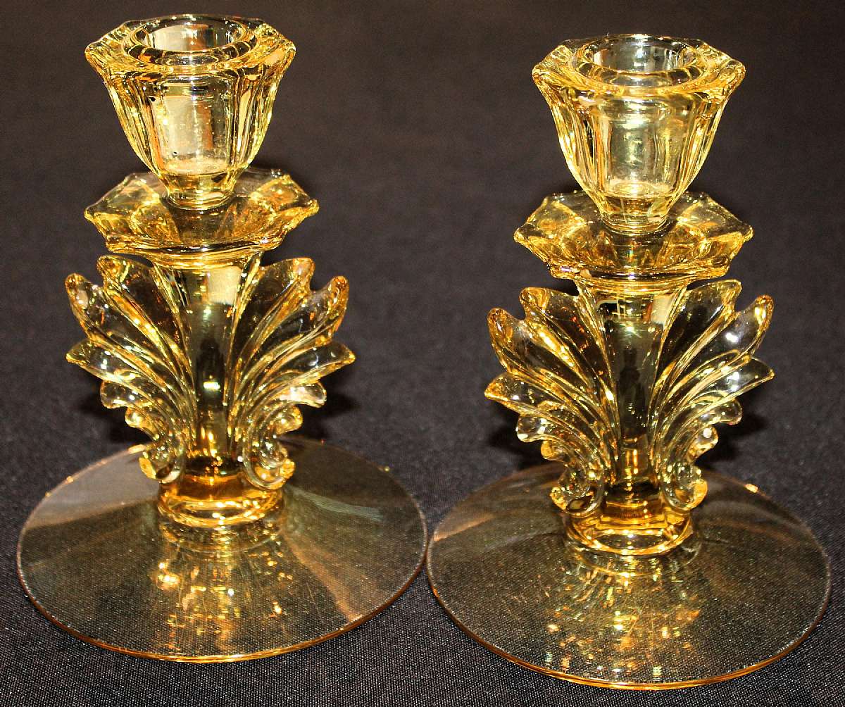 Up for sale is this Fostoria Baroque Yellow Glass Pair Of Candlestick Holders With An Art Deco Flame in excellent condition with no chips or cracks. They measure approx.  5 3/4"T by about 4 3/4" W. Shipping Excludes: Alaska/Hawaii, US Protector