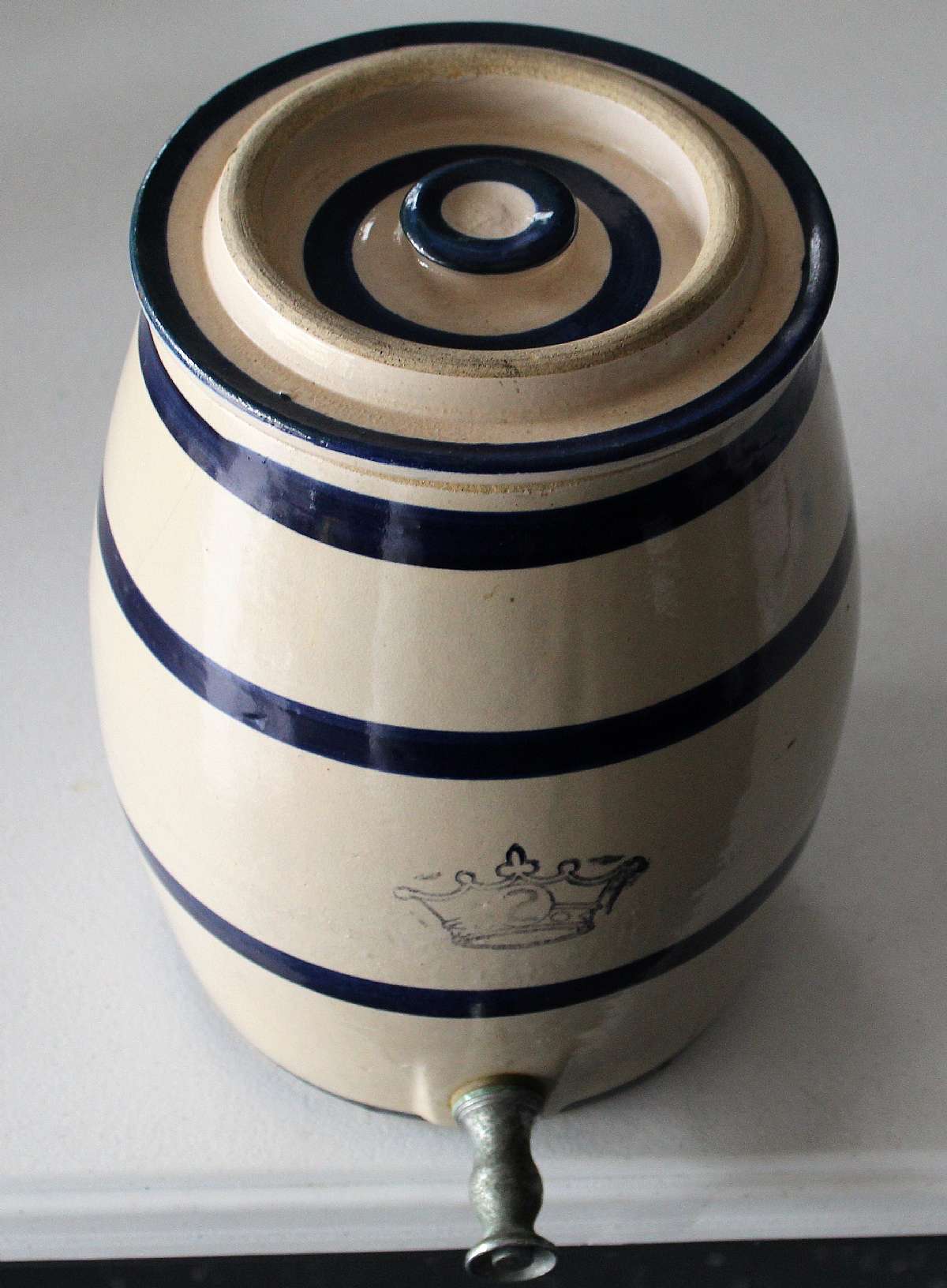 Up for sale is this Number Two Pottery Stoneware Water Cannister good condition. Measures approx. 11 1/2"T without the lid & 7 1/4"W at the top & 8"W at the bottom and weights about 11 1/2 Pounds. The water spout still works and I would say the seal needs