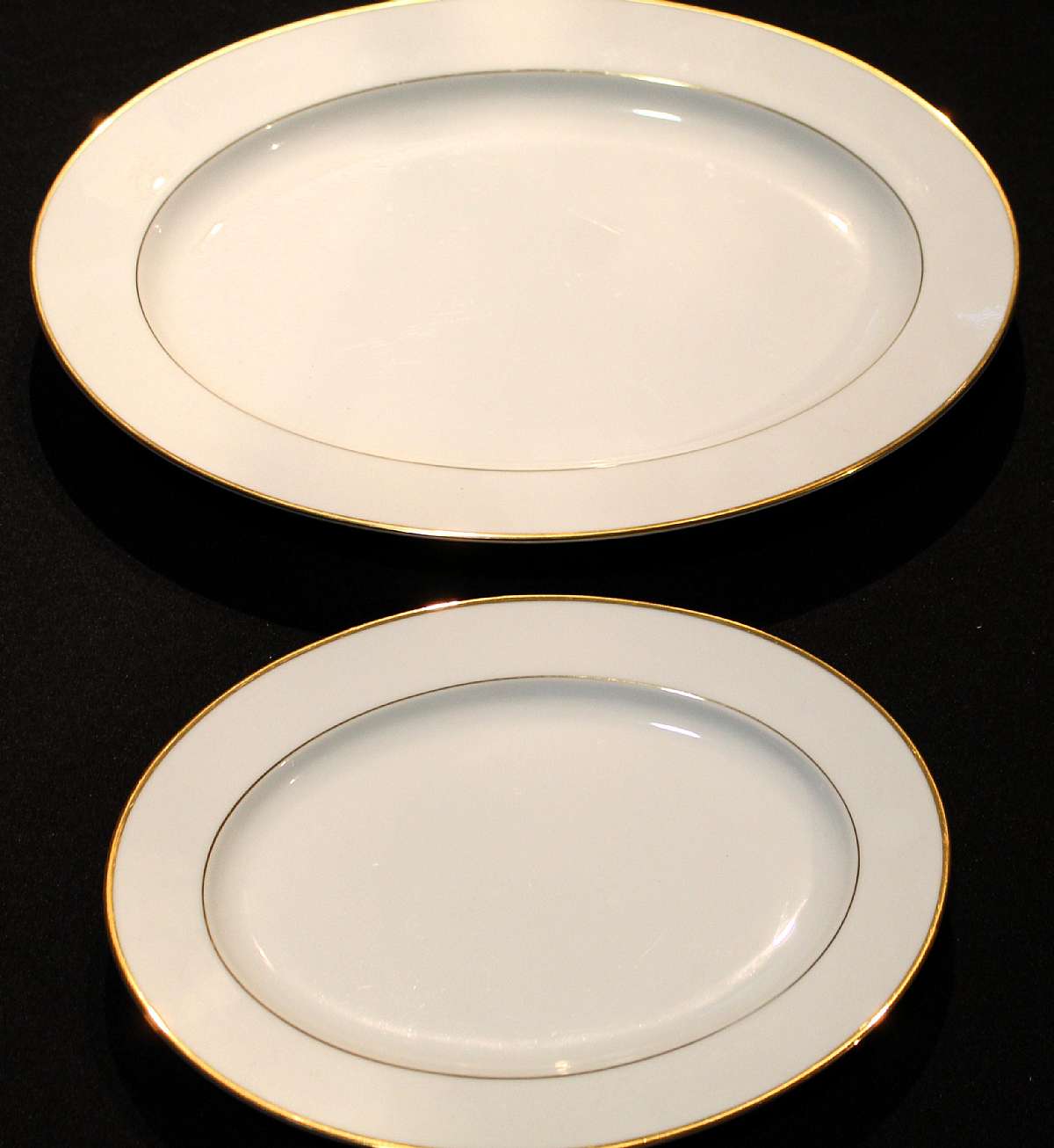 Up for sale are these Noritake Guilford Set Of Two Platters in excellent condition. No chips or cracks. I do not believe these were ever used. The platters measures approx. 16 by 12 inches and 11 1/2" by 8 3/4".  Shipping Excludes: Alaska/Hawai