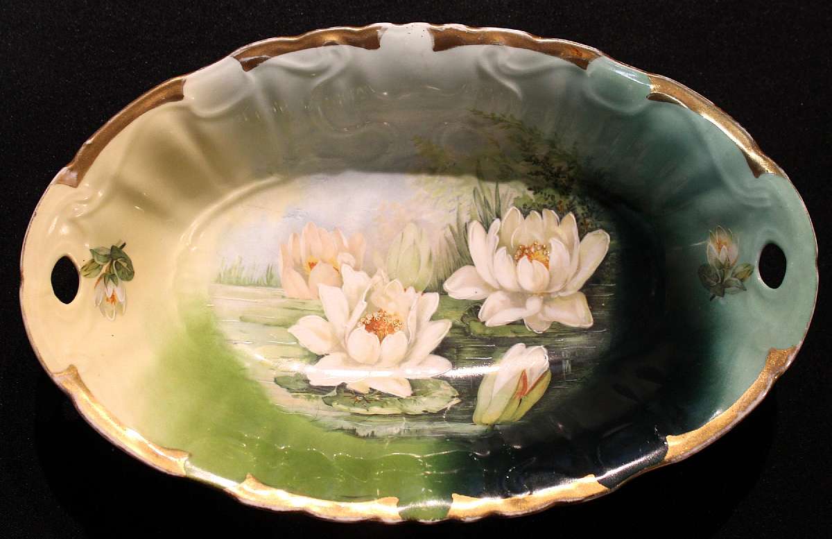 Up for sale is this used Antique Unmarked Hand Painted Water Lilly Large Oval Bowl in good condition with no chips. The bowl measures approx. 12 7/8"L by 8"W. There is a hairline crack.Shipping Excludes: Alaska/Hawaii, US Protectorates, APO/FPO