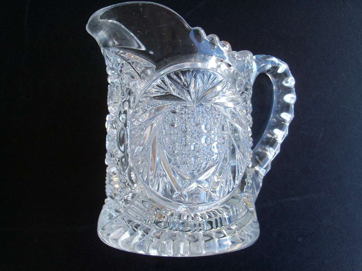 Up for sale is this beautiful well-made Antique Circa 1907 U.S. Glass Heart Plume Heartland Star Creamer or Milk Pitcher in excellent condition with no chips or cracks. Measures approx. 4 5/8 inches tall. Shipping Excludes: Alaska/Hawaii, US Protectorate
