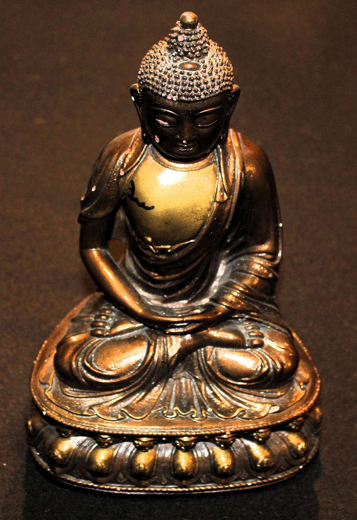 Up for sale is this Amitabha Budda Figurine. Measures approx. 11" T and at the base it measures approx. 5" by 6 3/4. The Figurine weighs about 7 pounds and has some wear to it.Shipping Excludes: Alaska/Hawaii, US Protectorates, APO/FPO, PO Box
