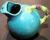 Up for sale is this Dept. 56 Cheryl Johnson Vineyard Tilted Ball Pitcher in excellent condition with no chips or cracks.  Measures approx. 6 1/2"T and holds approx. 64 ounces. The color is more that is pictured in the second picture. Shipping Exclu