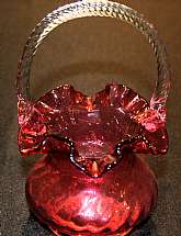 Up for sale is this Vintage Cranberry/Ruby Glass Basket in excellent condition with no chips or cracks. It measures approx. 8"T by 5"W.  Shipping Excludes: Alaska/Hawaii, US Protectorates, APO/FPO, PO BoxShipping Provided to the United States