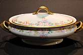 Up for sale is this Royal Bayreuth Antique Pink Rose Floral Oval Casserole in great condition with no chips, cracks or crazing. Minor Gold Wear. The casserole measures approx. 12 1/2"L Handle to Handle by 3 1/2"T. This mark was used around 1902.