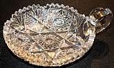 Up for sale is this Beautiful Antique Signed Libbey Saw Tooth Rim Heavily Decorated Handled Cut Glass Bowl. Measures approx. 6" wide by 1 3/2"T. No chips or cracks.Shipping Excludes: Alaska/Hawaii, US Protectorates, APO/FPO, PO BoxShipping Pr